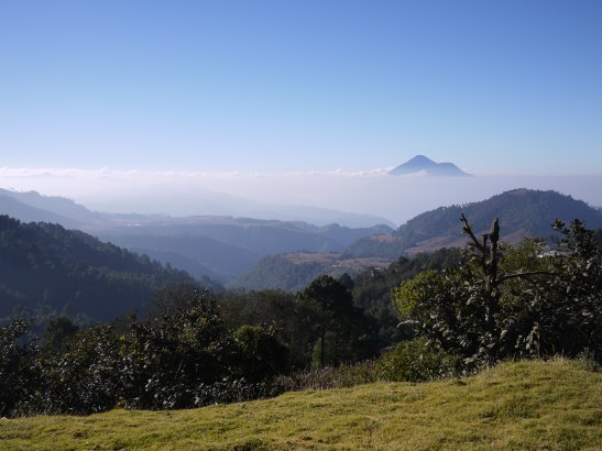 Lago Atitlan is somewhere in those clouds.