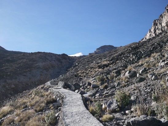 The labyrinth trail actually starts an an old crumbly aqueduct that used to supply water to the towns at lower elevations. Sadly, due to changing climates, the receding glacier no longer can supply this water. Now it serves as a trail for a few hundred feet and a reminder of our impacts on this planet.